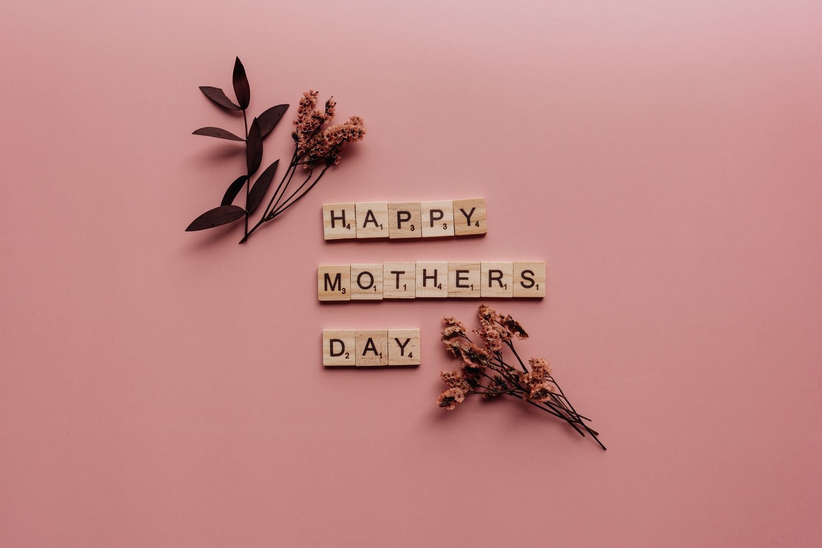 Mother and daughter smiling for a photo on Mother's Day